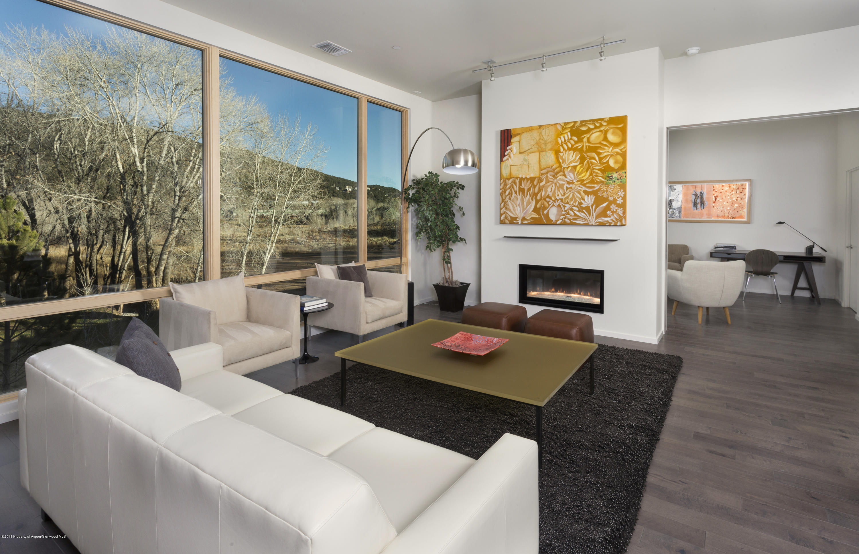 102 Evans Road, Unit 107 Basalt, CO 81621 - Photo 15 of 62 a living room with furniture fireplace and large window