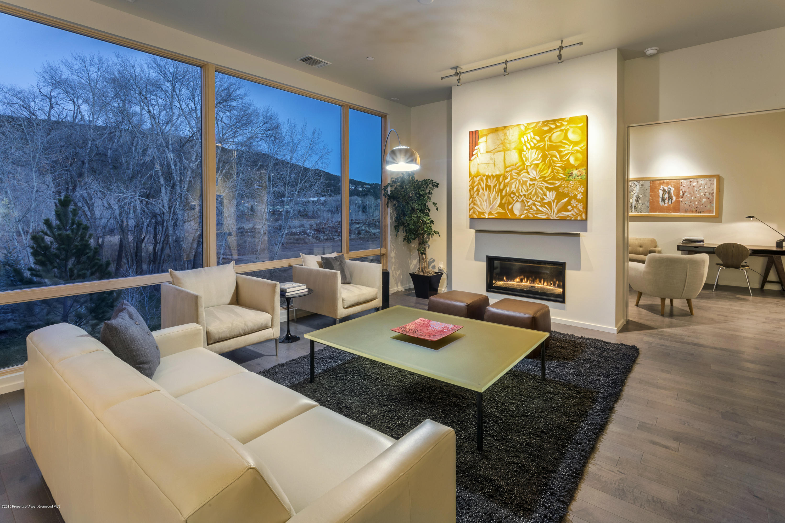 102 Evans Road, Unit 107 Basalt, CO 81621 - Photo 25 of 62 a living room with furniture and a fireplace