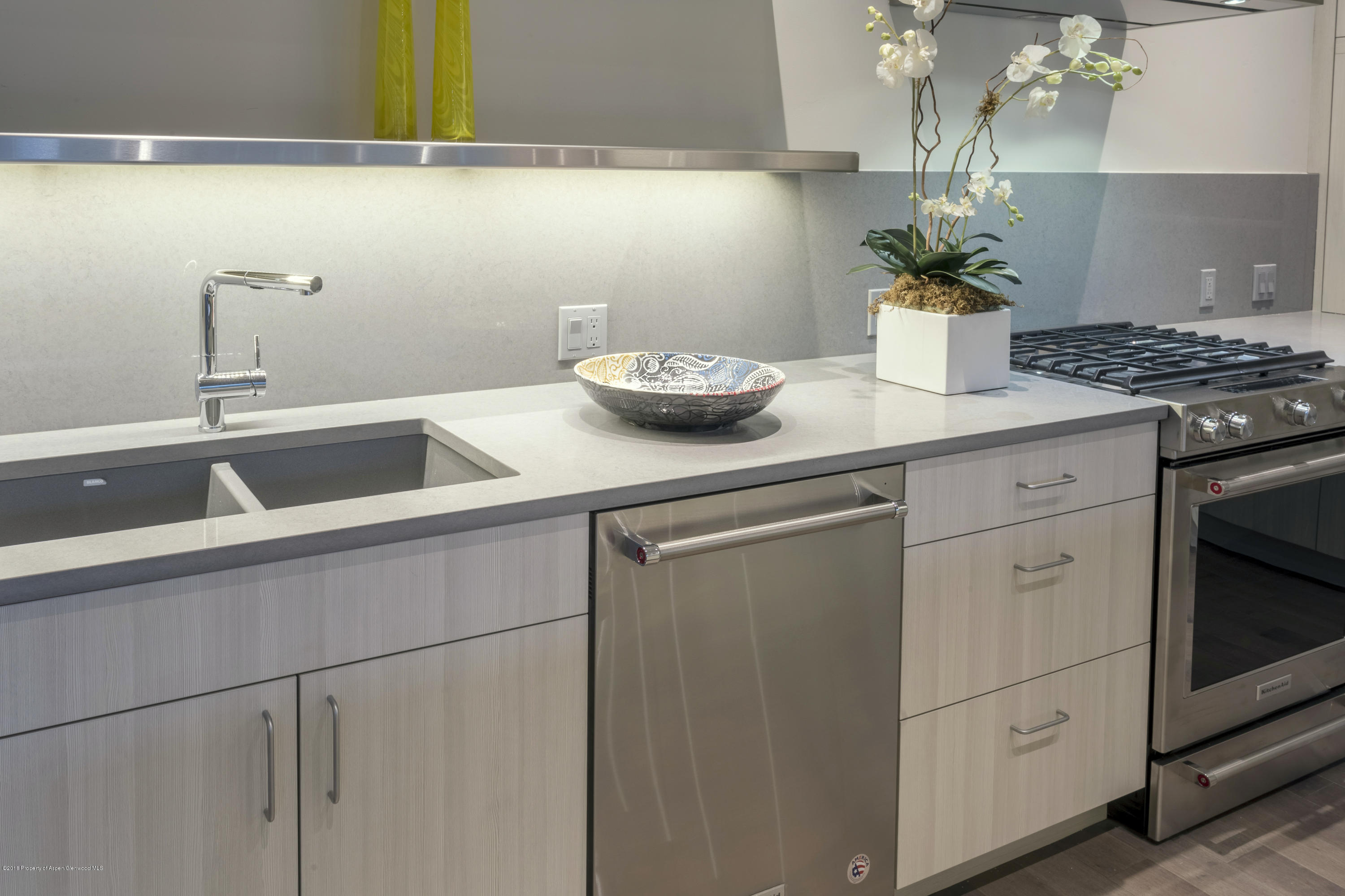 102 Evans Road, Unit 107 Basalt, CO 81621 - Photo 37 of 62 a kitchen with a sink and cabinets