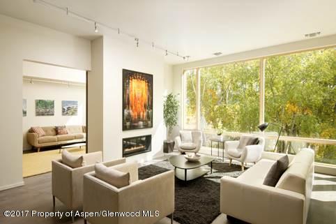 102 Evans Road, Unit 107 Basalt, CO 81621 - Photo 8 of 62 a living room with furniture and a large window