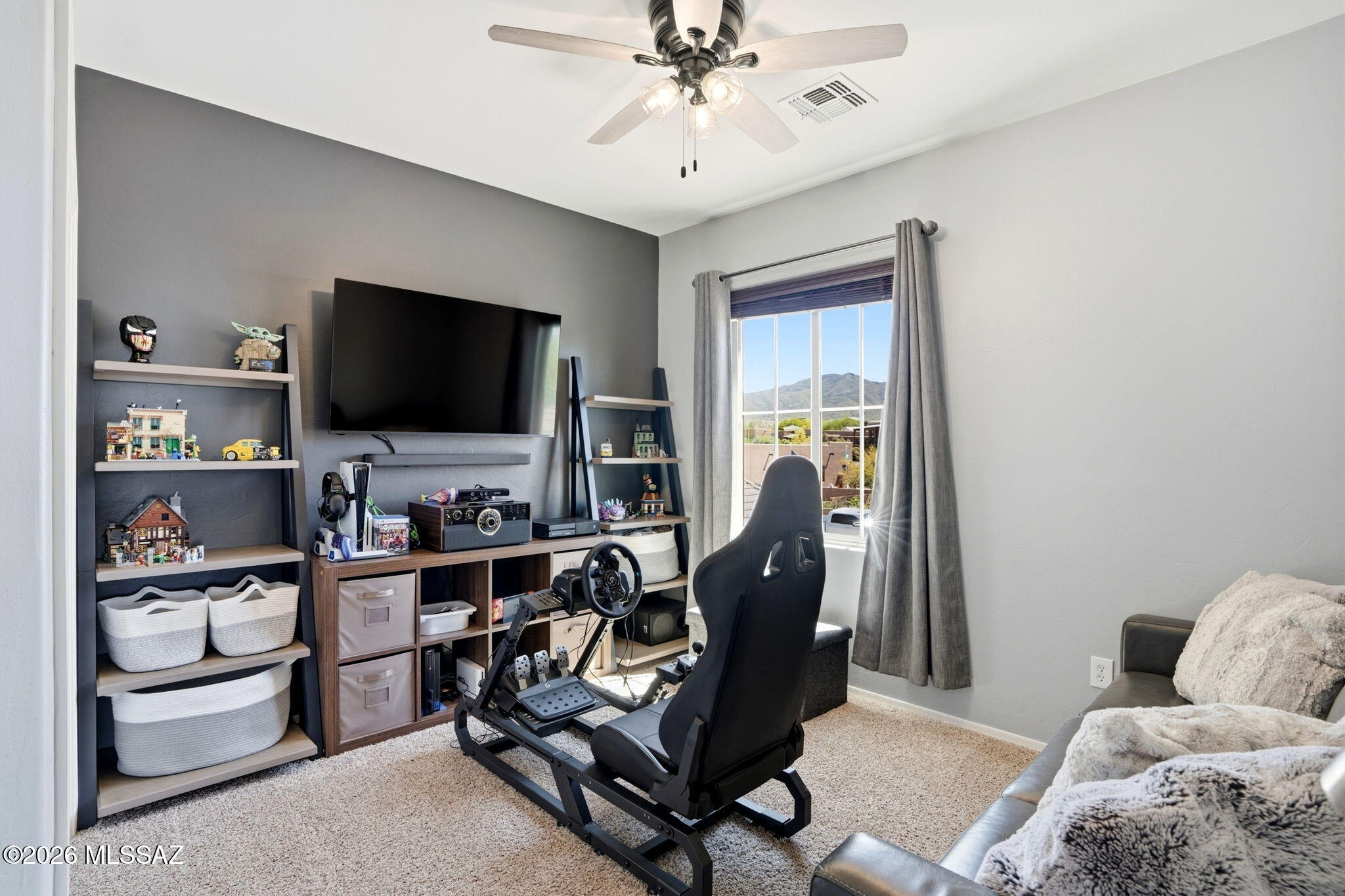 211 East Refuge Loop Vail, AZ 85641 - Photo 24 of 48 a living room with furniture and a flat screen tv