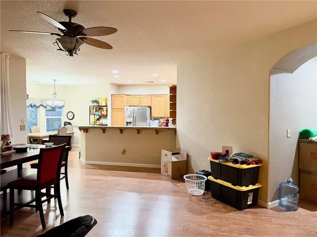 a living room with a couch and a chandelier