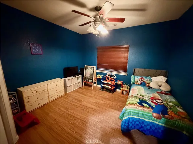 a bedroom with bed and window