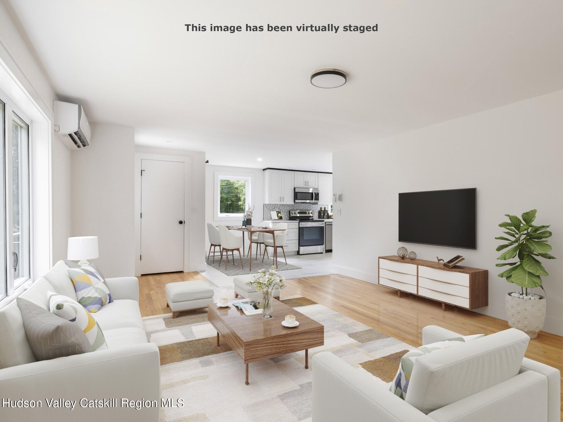 14 Goat Hill Road Saugerties, NY 12477 - Photo 12 of 26 a living room with furniture and a flat screen tv