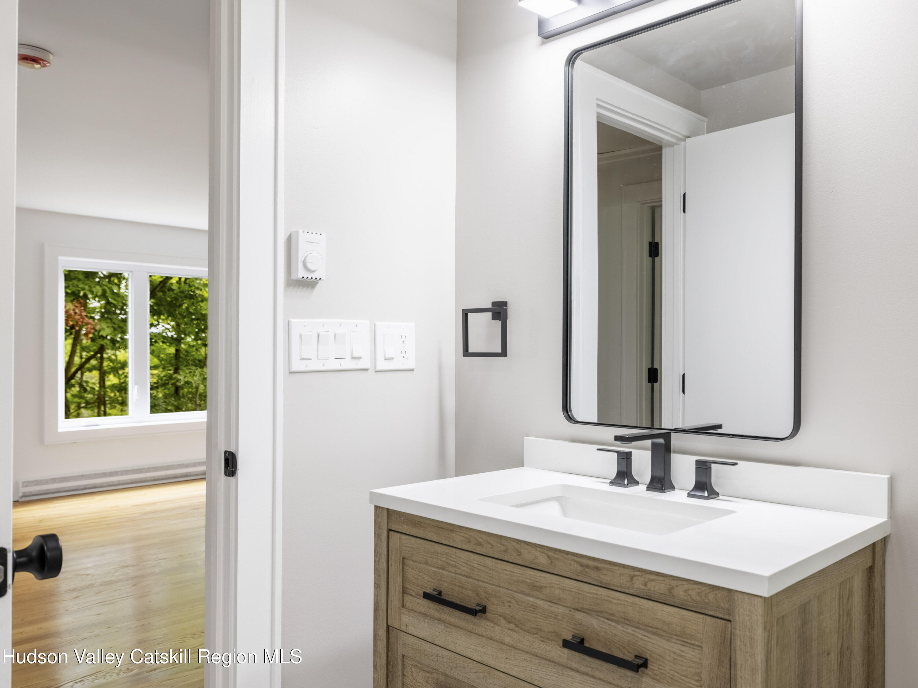 14 Goat Hill Road Saugerties, NY 12477 - Photo 13 of 26 a bathroom with a sink vanity and a mirror