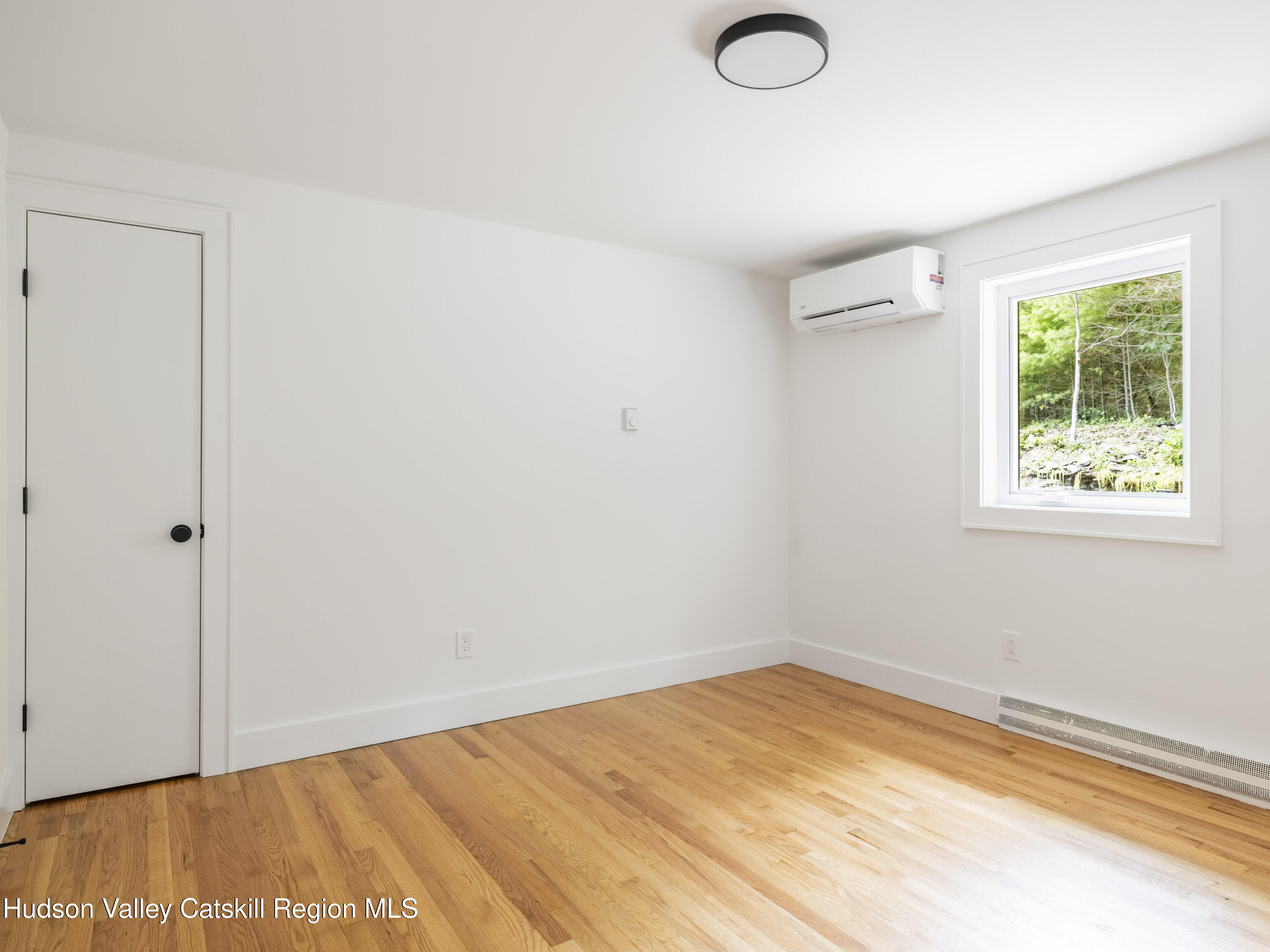 14 Goat Hill Road Saugerties, NY 12477 - Photo 16 of 26 a view of empty room with wooden floor and fan