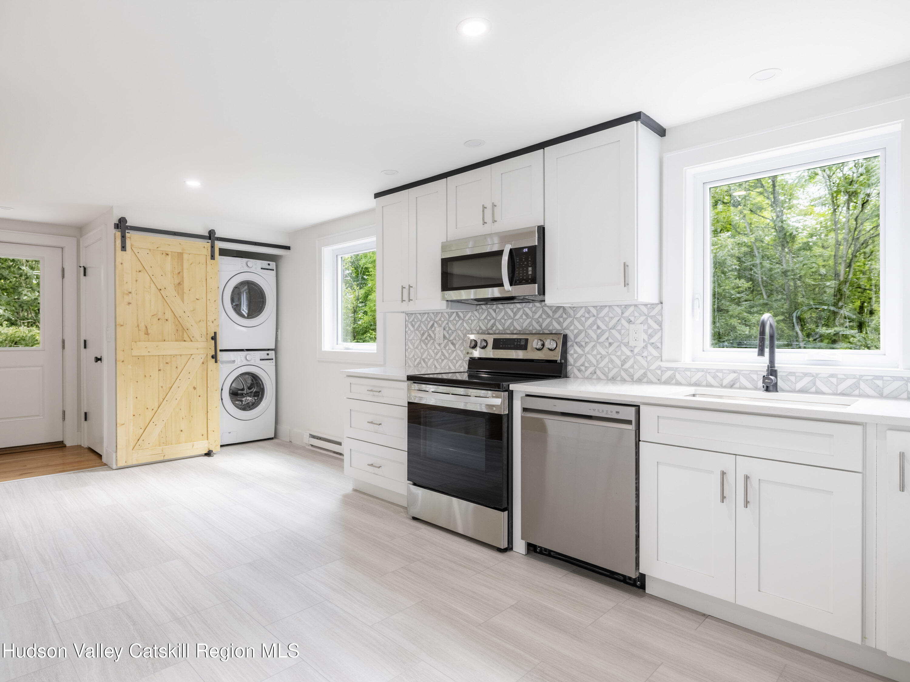 14 Goat Hill Road Saugerties, NY 12477 - Photo 2 of 26 a kitchen with stainless steel appliances granite countertop a stove a sink and a microwave