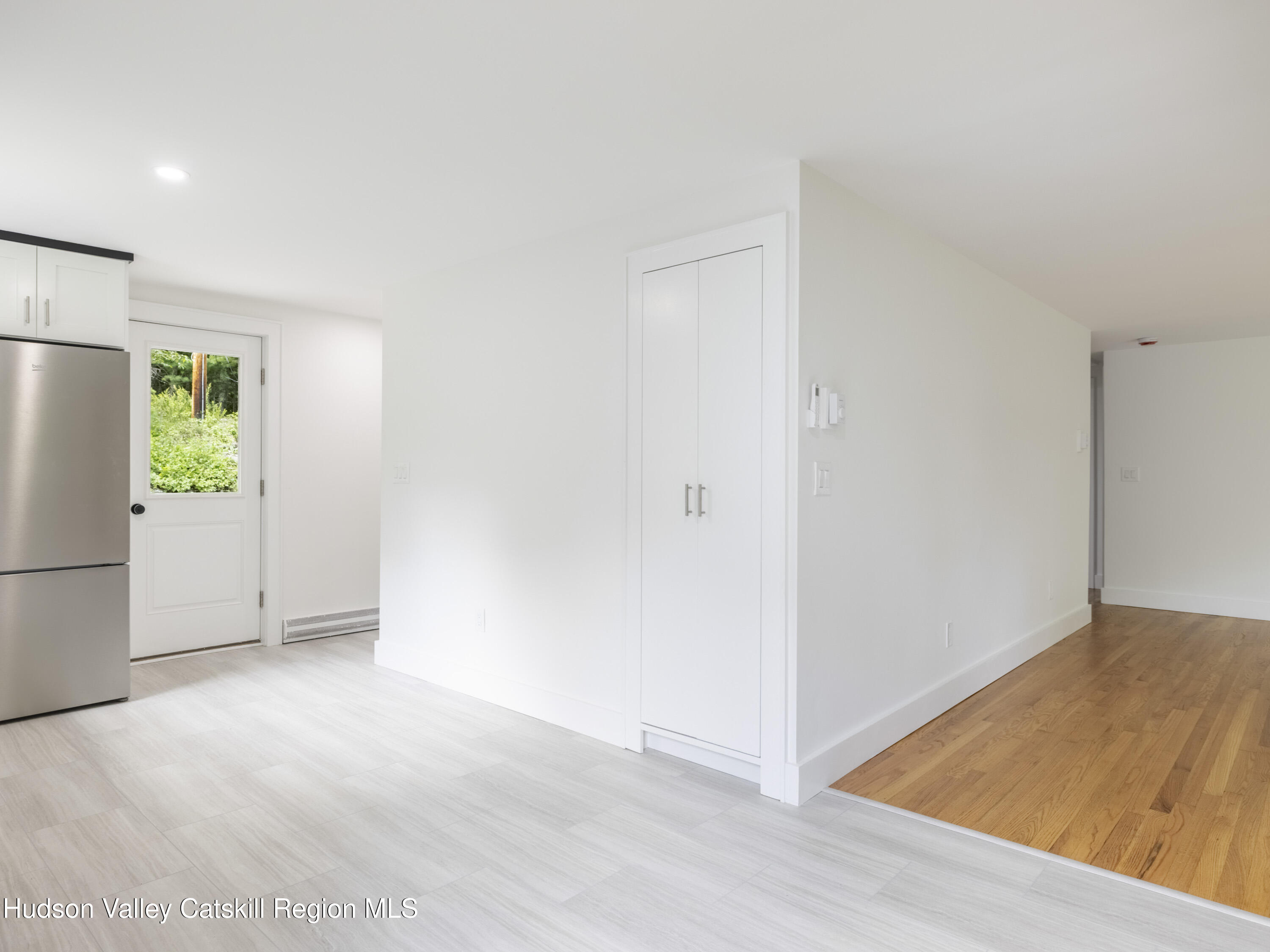 14 Goat Hill Road Saugerties, NY 12477 - Photo 21 of 26 a view of an empty room with a refrigerator