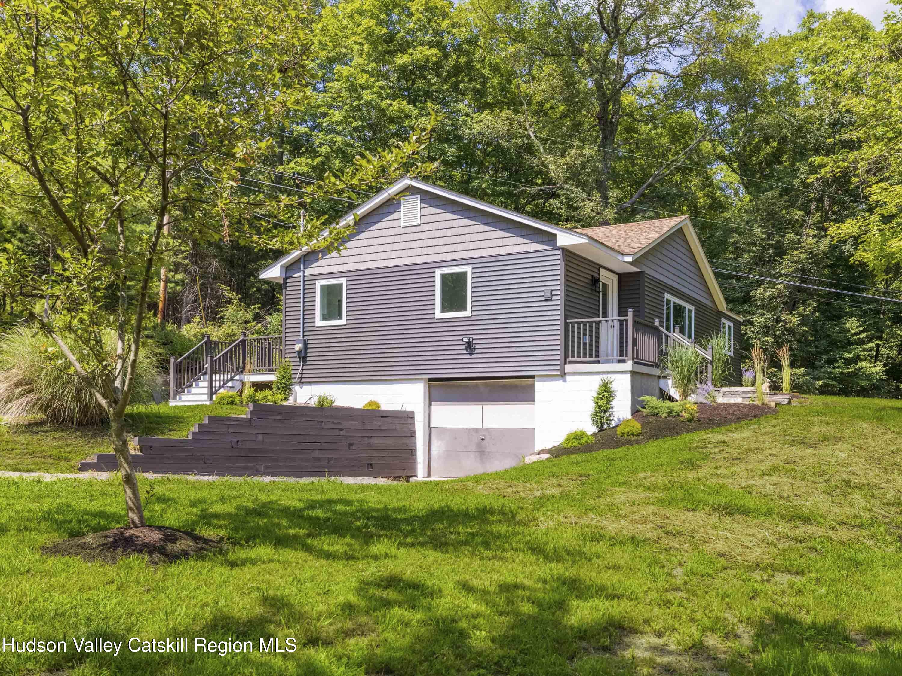 14 Goat Hill Road Saugerties, NY 12477 - Photo 25 of 26 a front view of a house with a garden