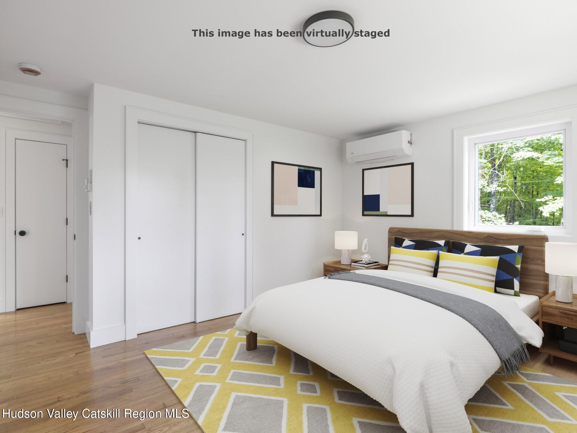 14 Goat Hill Road Saugerties, NY 12477 - Photo 8 of 26 a bedroom with a bed and a night stand