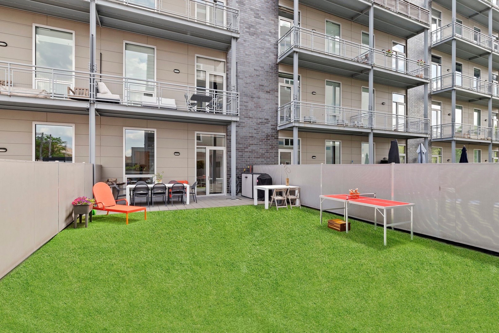 128 South Aberdeen Street, Unit 2N Chicago, IL 60607 - Photo 26 of 31 a view of a backyard with table and chairs and potted plants