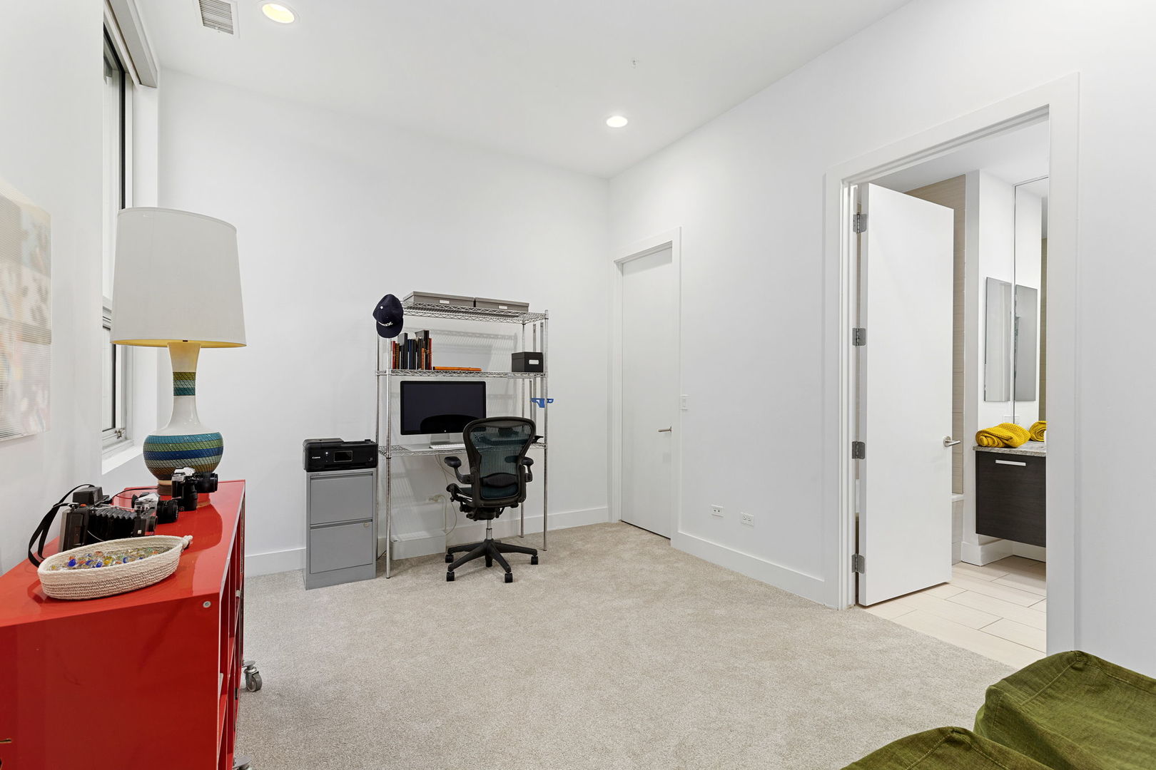 128 South Aberdeen Street, Unit 2N Chicago, IL 60607 - Photo 28 of 31 a view of a workspace with furniture and a window