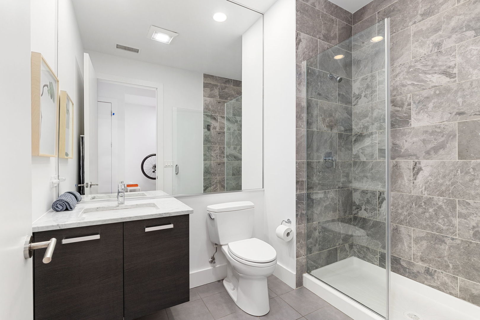 128 South Aberdeen Street, Unit 2N Chicago, IL 60607 - Photo 29 of 31 a bathroom with a sink a toilet and shower