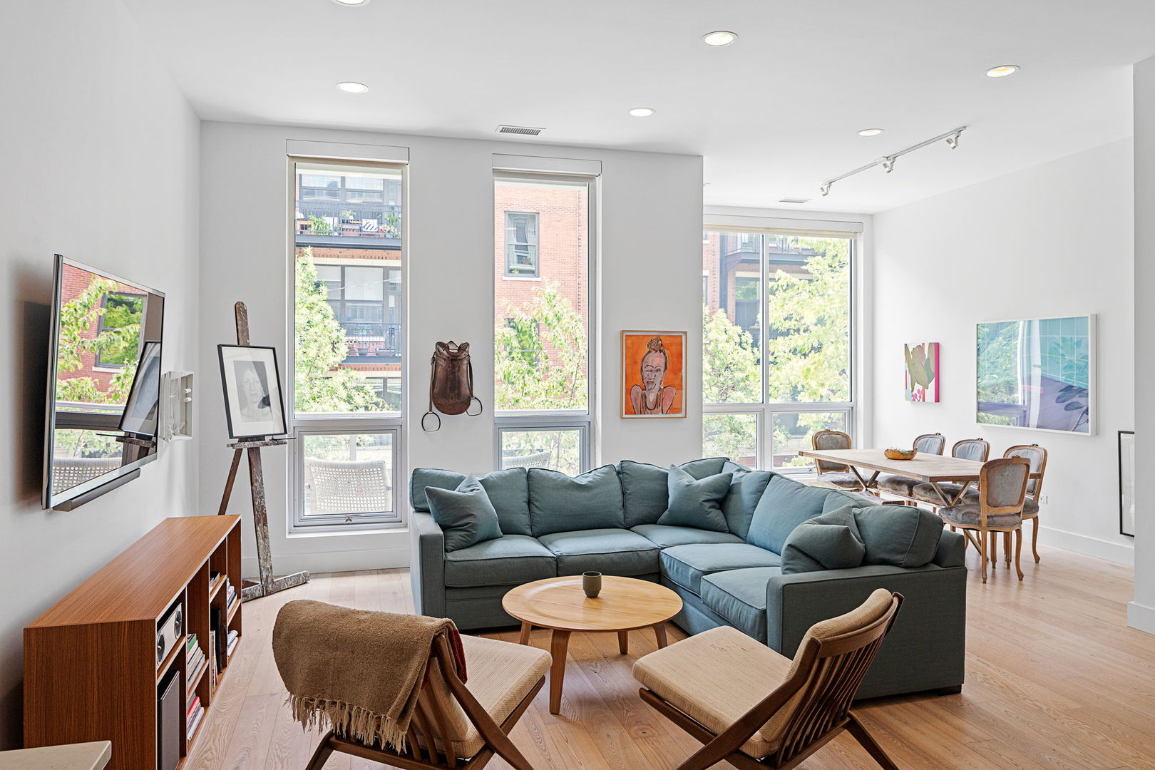 128 South Aberdeen Street, Unit 2N Chicago, IL 60607 - Photo 5 of 31 a living room with furniture and a large window