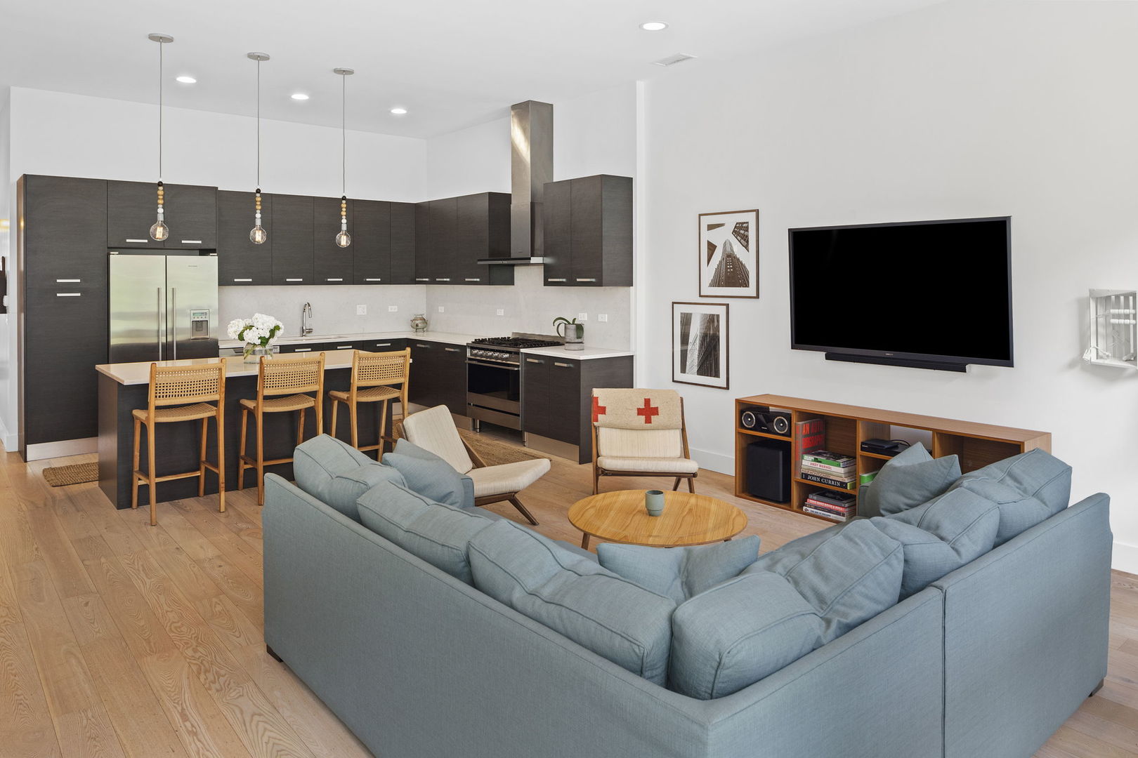 128 South Aberdeen Street, Unit 2N Chicago, IL 60607 - Photo 8 of 31 a living room with furniture kitchen view and a flat screen tv