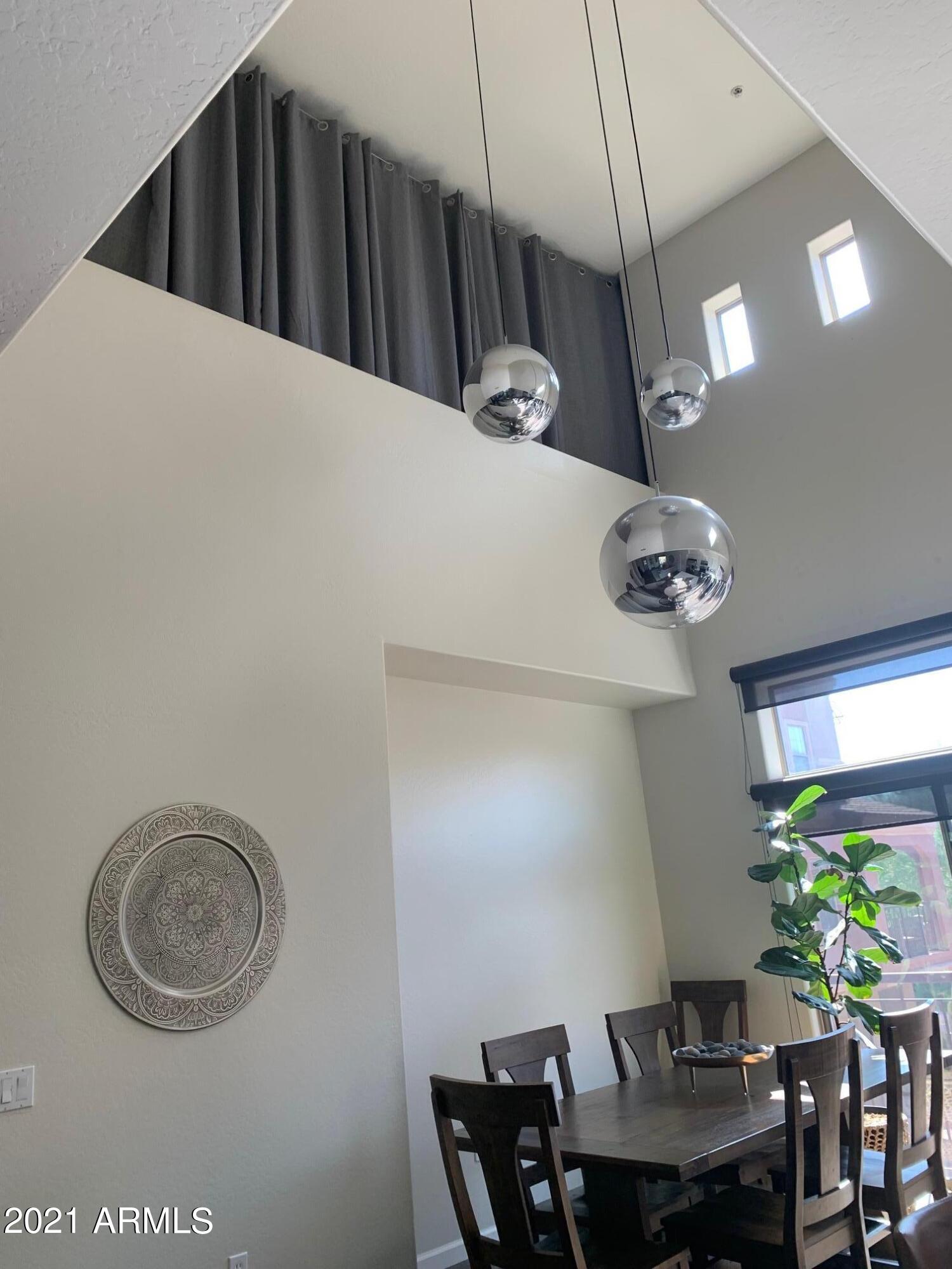 3935 East Rough Rider Road, Unit 1005 Phoenix, AZ 85050 - Photo 17 of 60 Full Dining Table with Loft Above