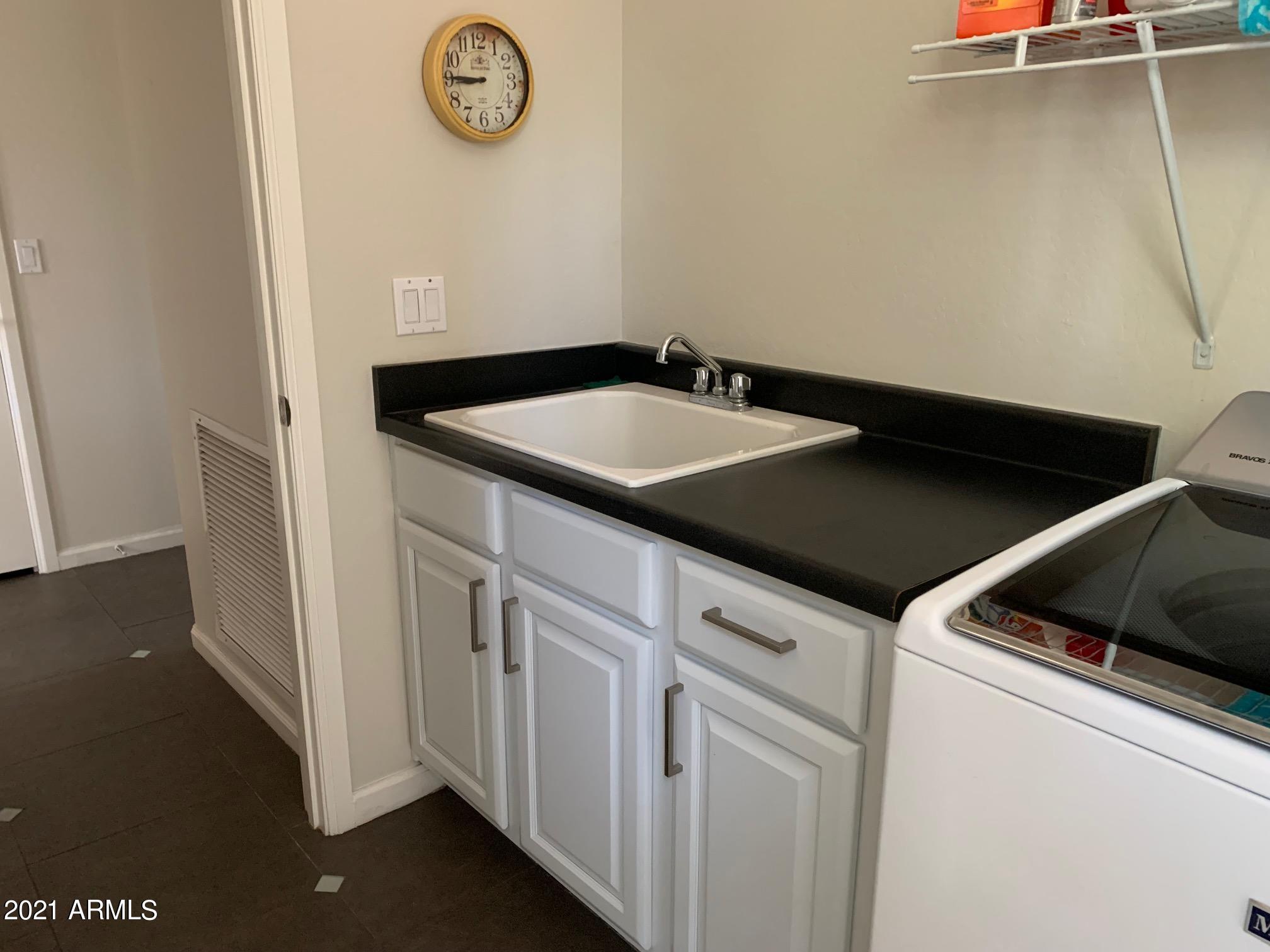 3935 East Rough Rider Road, Unit 1005 Phoenix, AZ 85050 - Photo 37 of 60 Laundry #2 - Sink