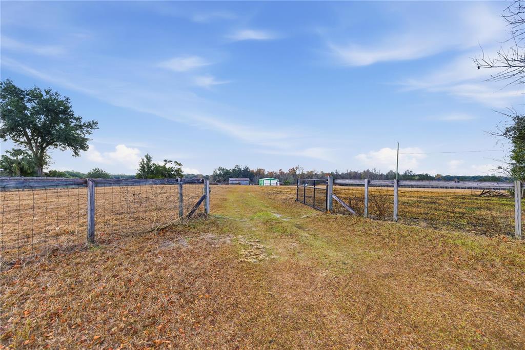 9900 Southeast Sunset Harbor Road Summerfield, FL 34491 - Photo 4 of 44 a view of a water yard