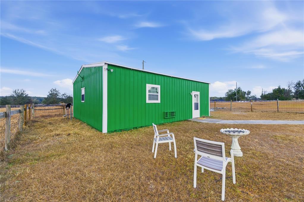 9900 Southeast Sunset Harbor Road Summerfield, FL 34491 - Photo 8 of 44 a view of a big room with a big yard