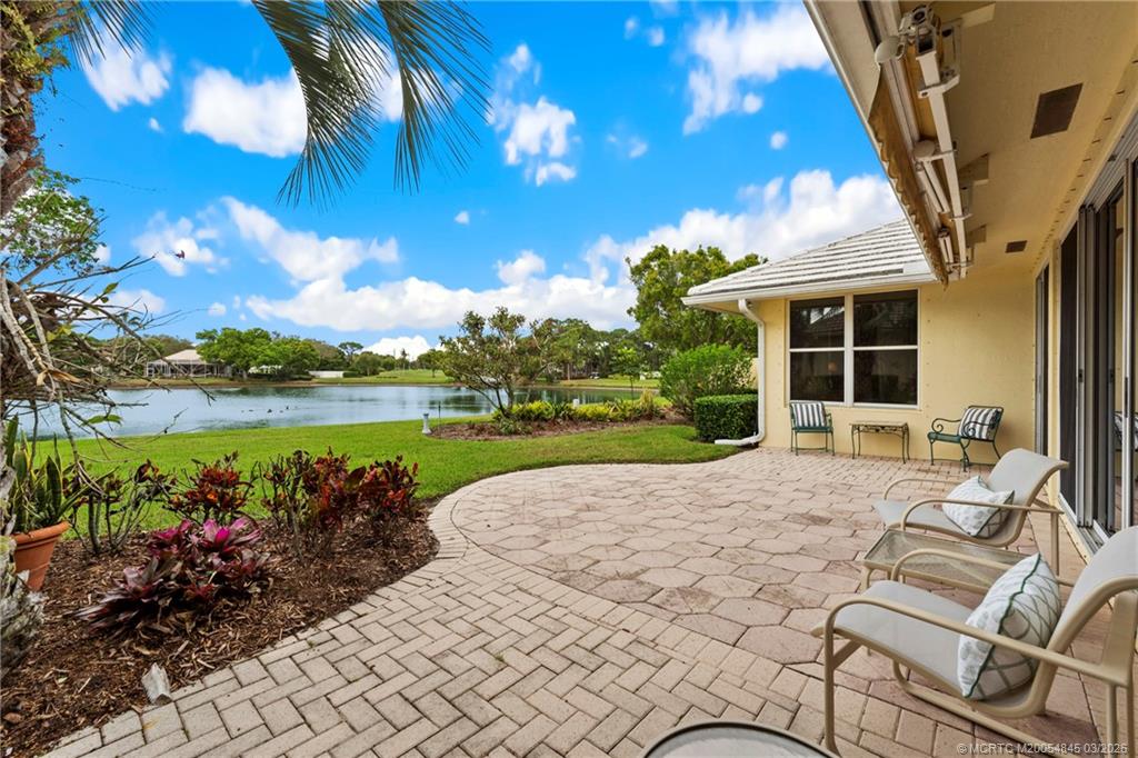 3510 Southeast Cambridge Drive Stuart, FL 34997 - Photo 25 of 38 Open paver patio with awning