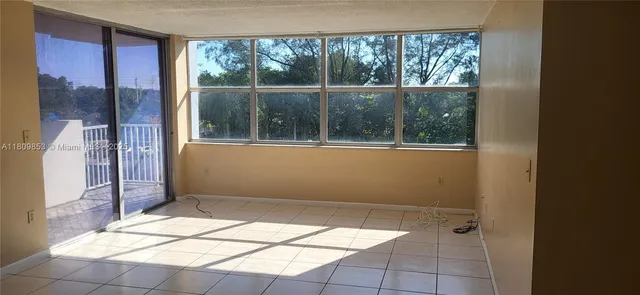 a view of a room that has a window in it