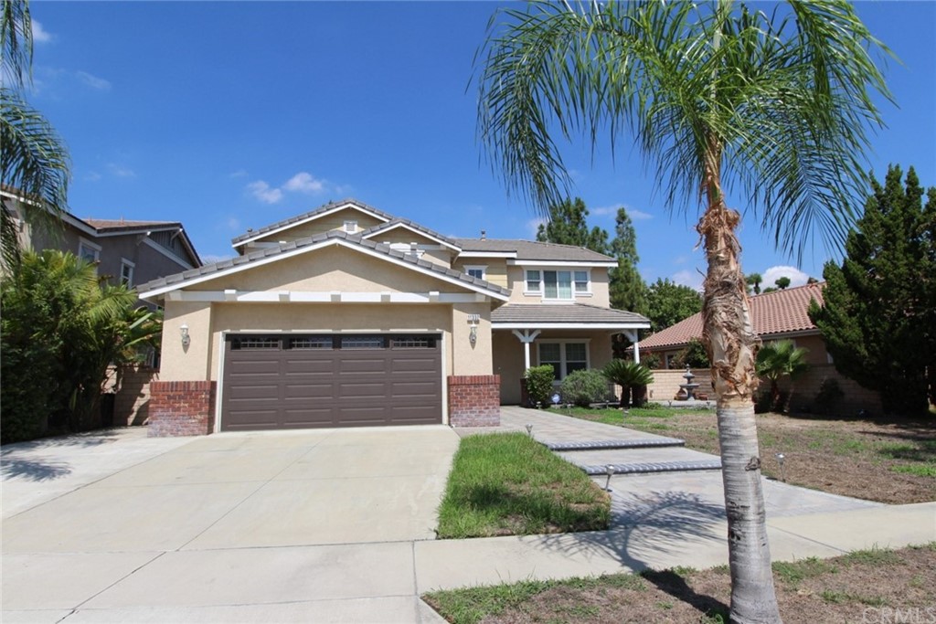 11332 Fitzpatrick Drive Rancho Cucamonga, CA 91730 - Photo 1 of 1 a front view of a house with a yard