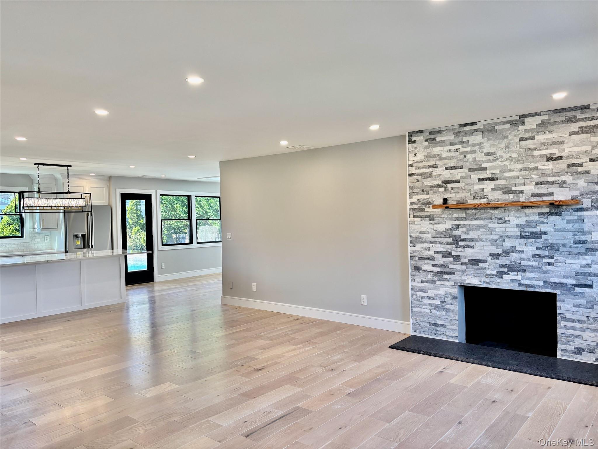 188 Sequams Lane Centre West Islip, NY 11795 - Photo 2 of 27 a view of an empty room with a fireplace and a window