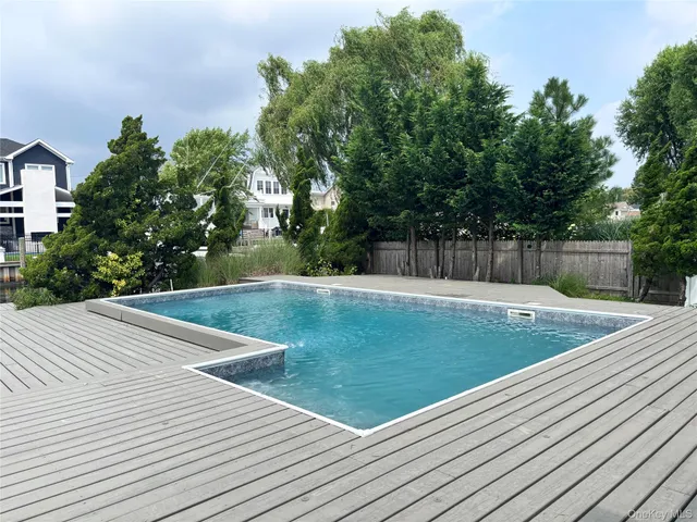 a view of a swimming pool with a patio