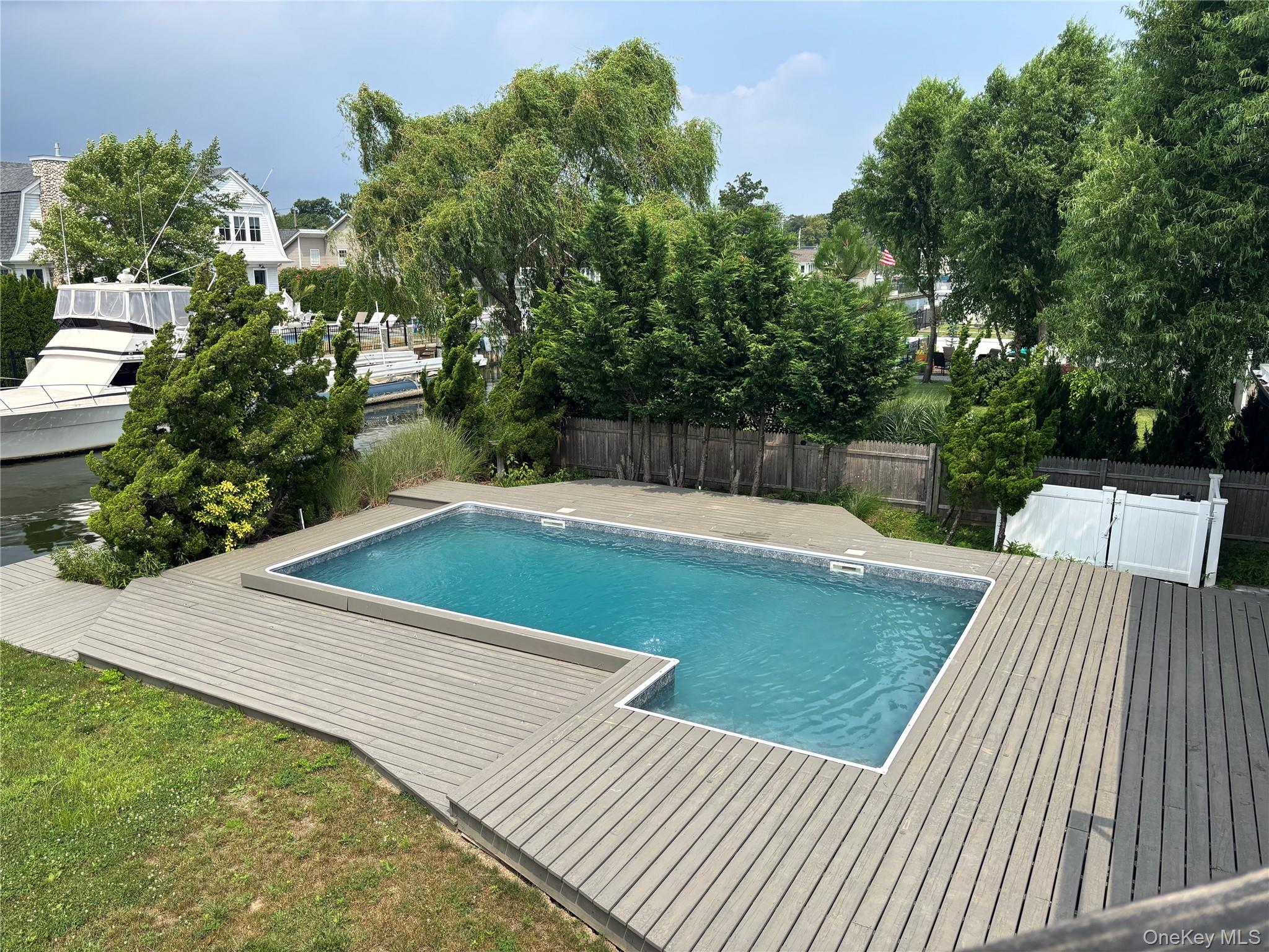 188 Sequams Lane Centre West Islip, NY 11795 - Photo 25 of 27 a view of a swimming pool with a patio