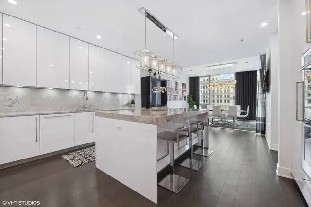 a kitchen with a sink cabinets and window