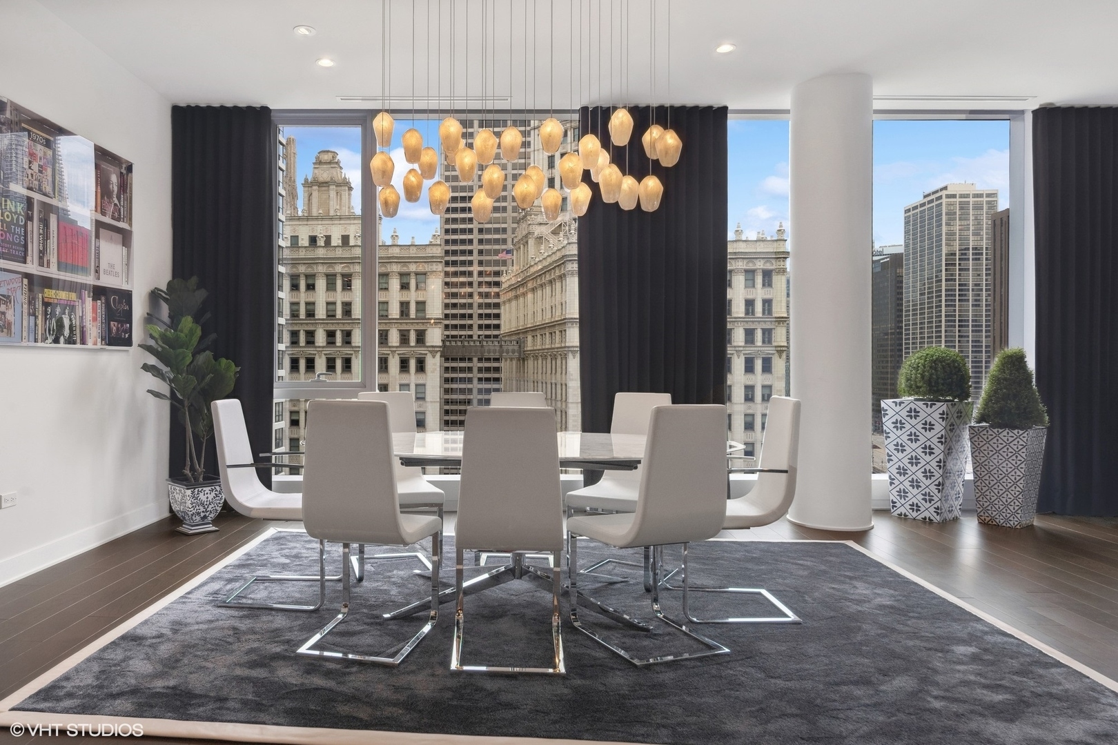 403 North Wabash Avenue, Unit 14A Chicago, IL 60611 - Photo 15 of 49 a view of a dining room with furniture and chandelier