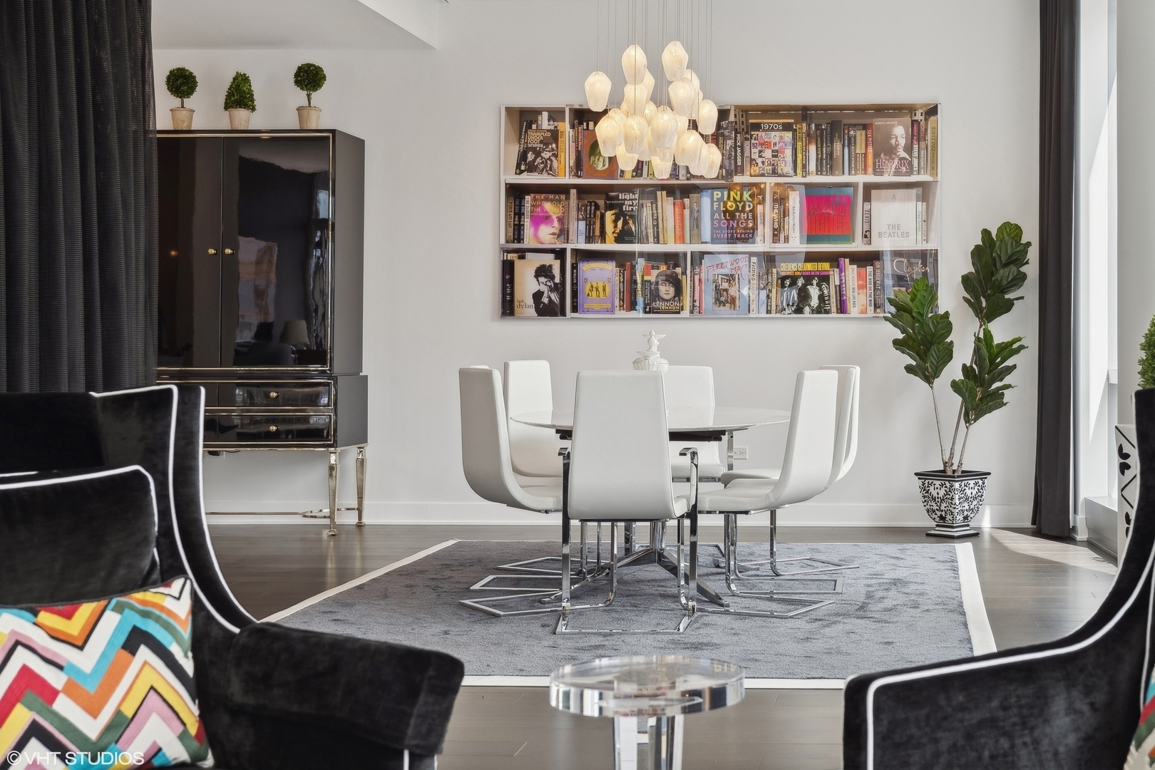 403 North Wabash Avenue, Unit 14A Chicago, IL 60611 - Photo 16 of 49 a view of a dining room with furniture and a potted plant