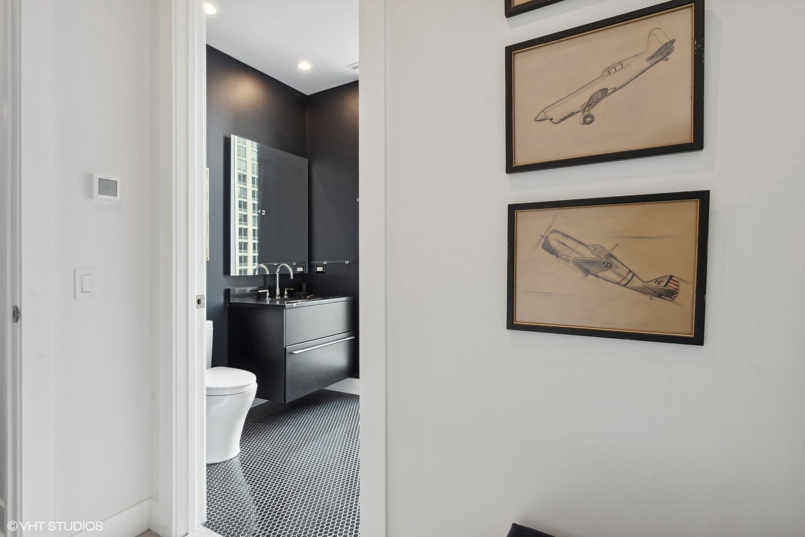 403 North Wabash Avenue, Unit 14A Chicago, IL 60611 - Photo 19 of 49 a bathroom with a toilet and a view of a bathroom