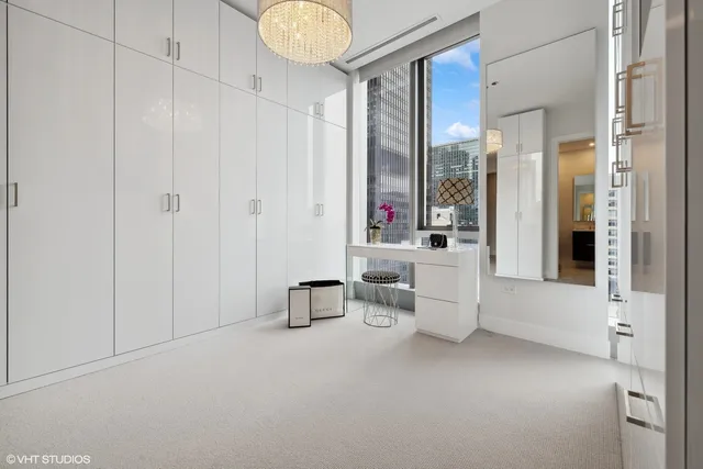 a view of living room filled with furniture and window