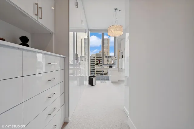 a kitchen with cabinets and window