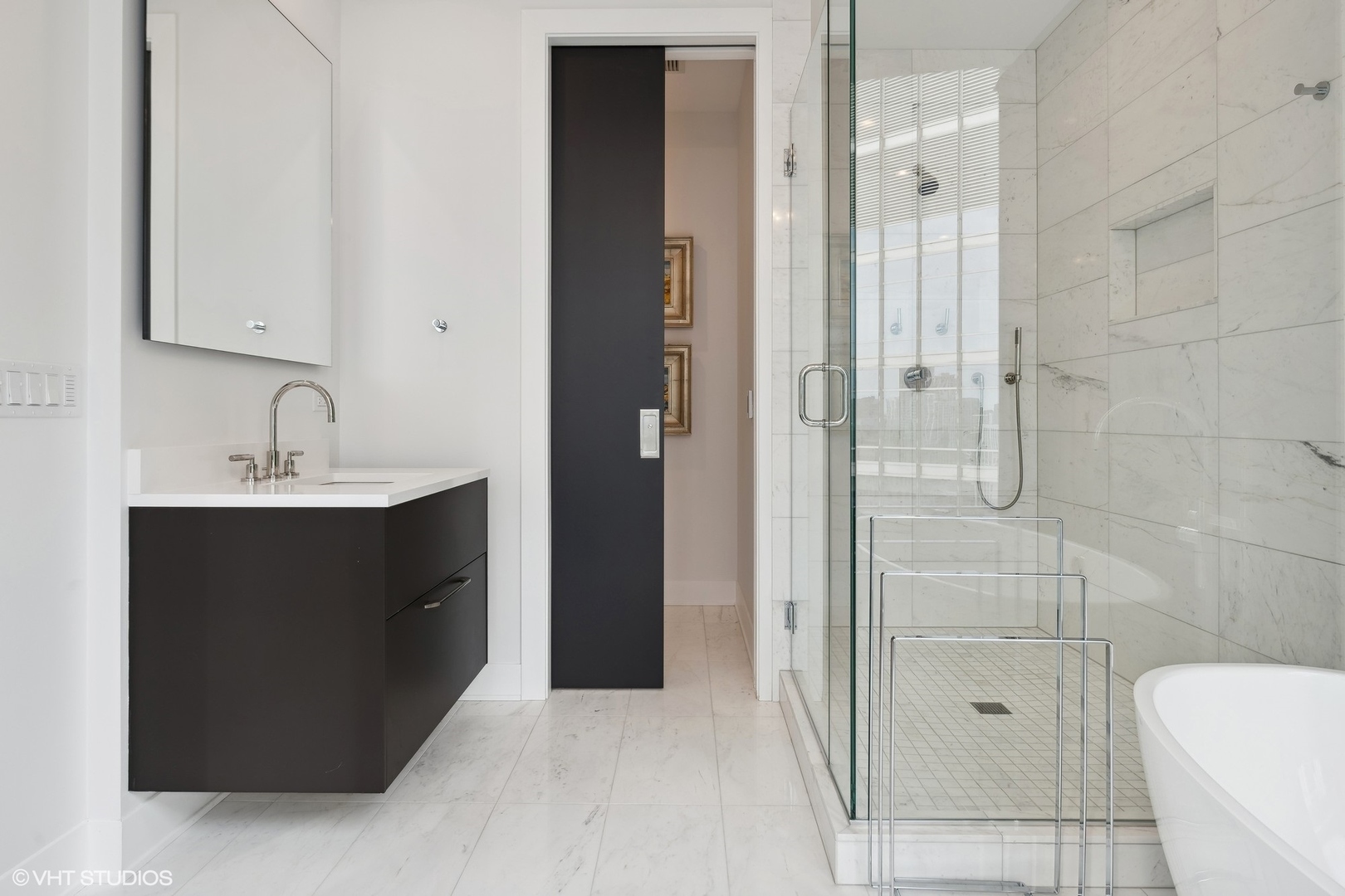 403 North Wabash Avenue, Unit 14A Chicago, IL 60611 - Photo 29 of 49 a bathroom with a sink and a mirror