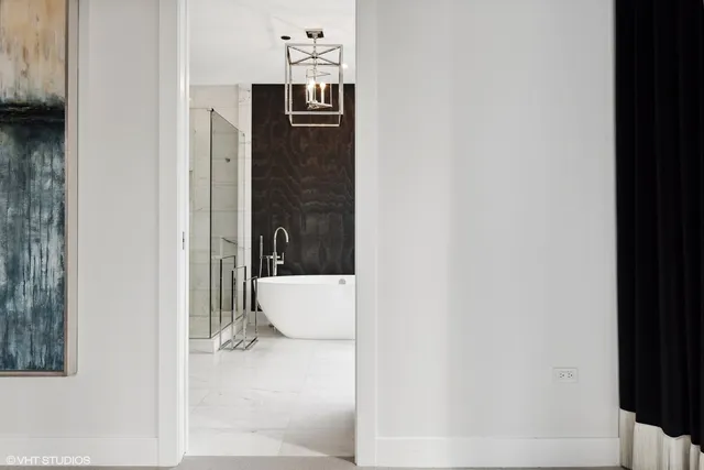 a bathroom with a bathtub and shower