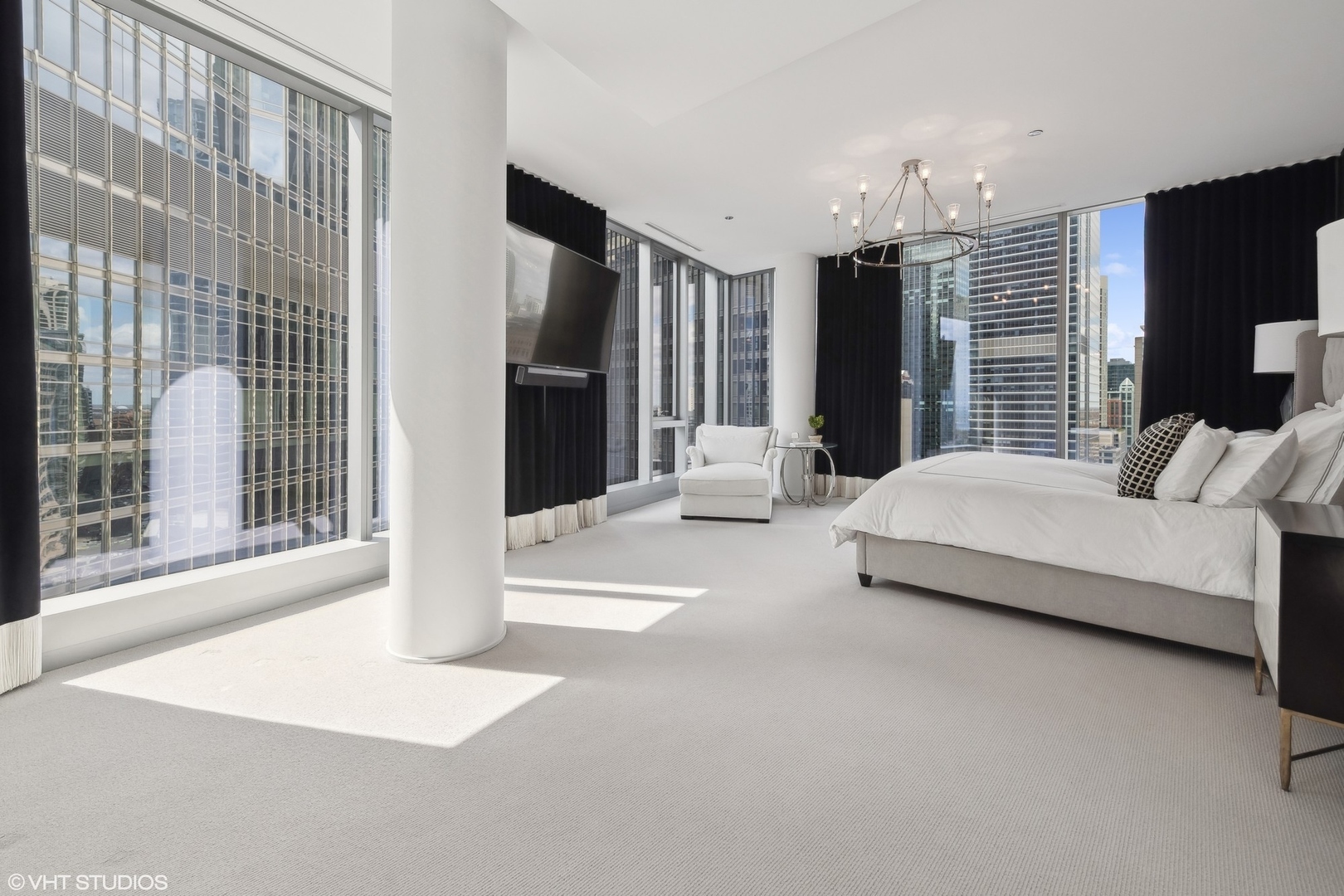 403 North Wabash Avenue, Unit 14A Chicago, IL 60611 - Photo 35 of 49 a spacious bedroom with a large bed and a large window