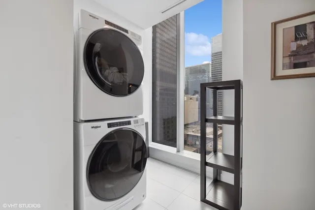 a view of a hallway with washer and dryer