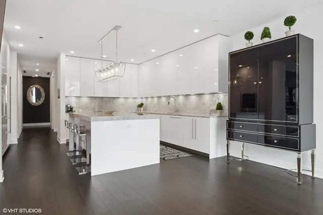 a view of kitchen with cabinets and wooden floor