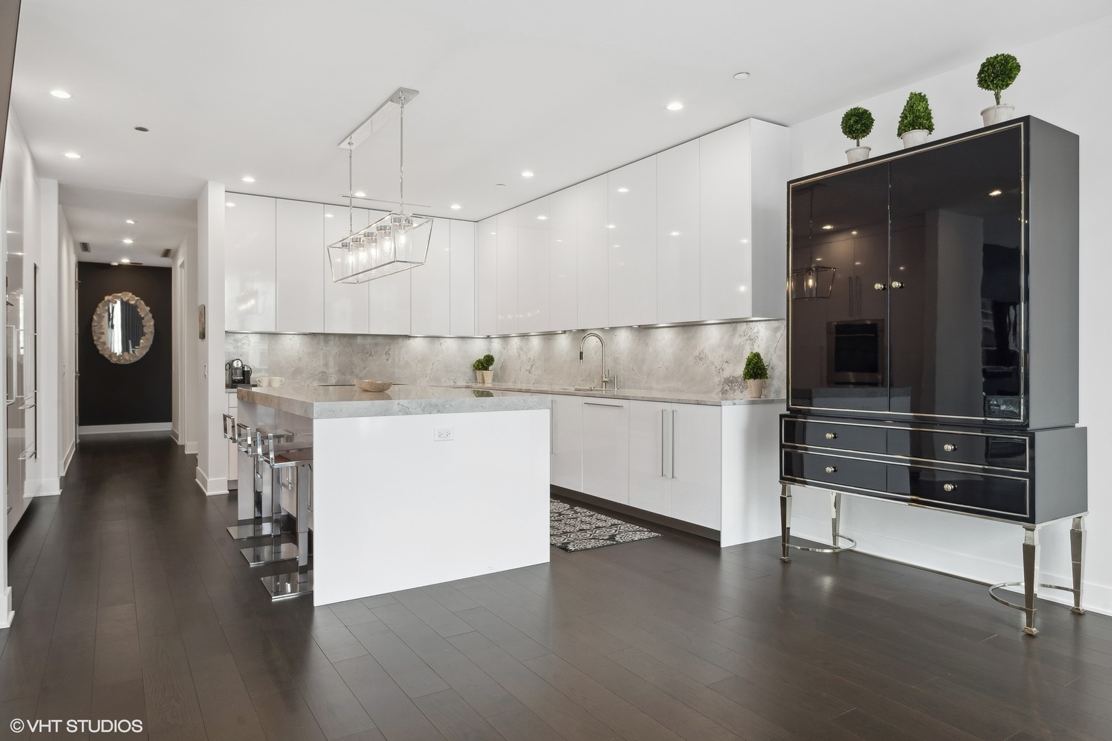 403 North Wabash Avenue, Unit 14A Chicago, IL 60611 - Photo 10 of 49 a view of kitchen with cabinets and wooden floor