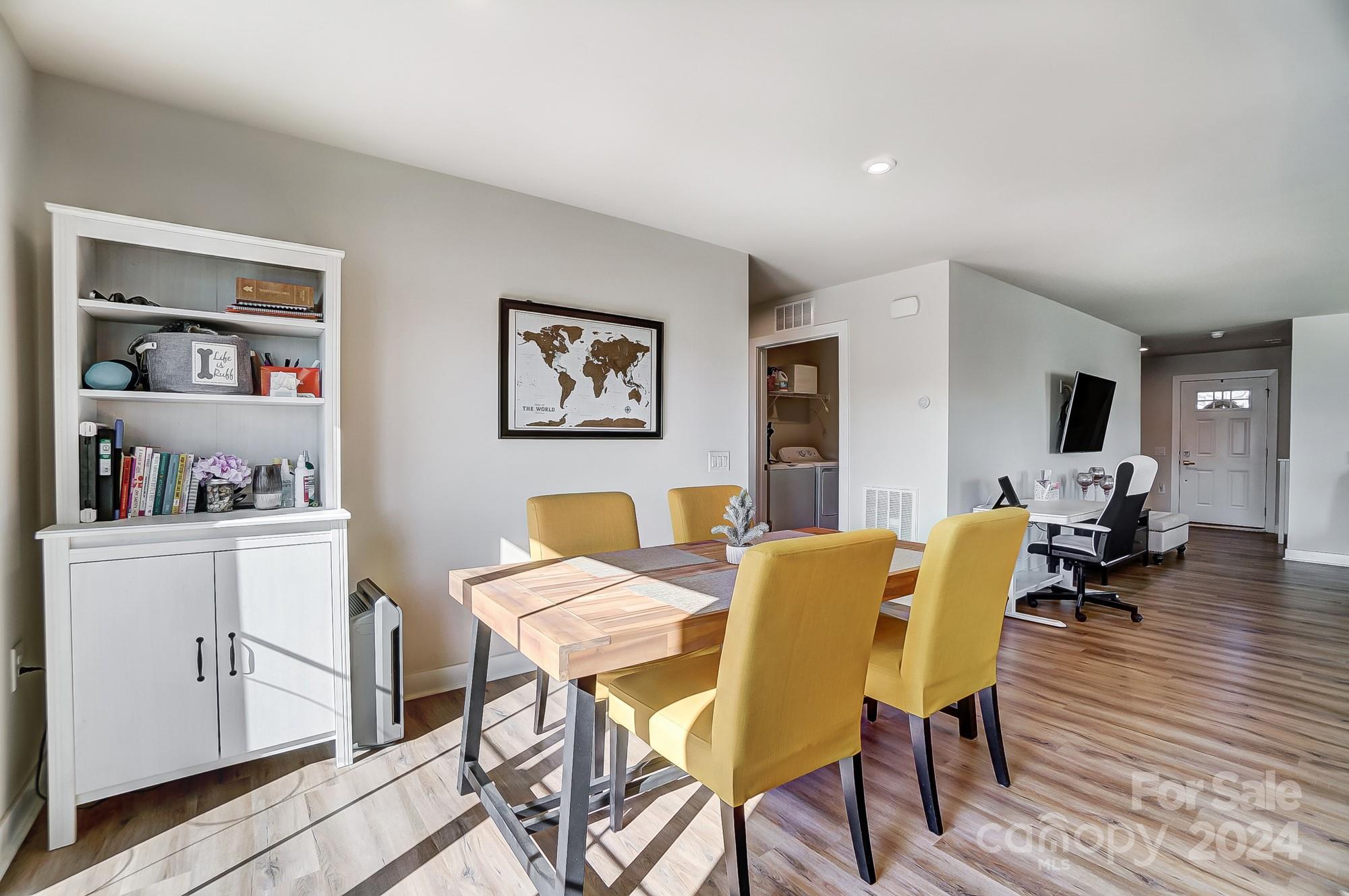 4136 Mackinnon Drive Charlotte, NC 28214 - Photo 17 of 48 a view of a dining room with furniture and wooden floor