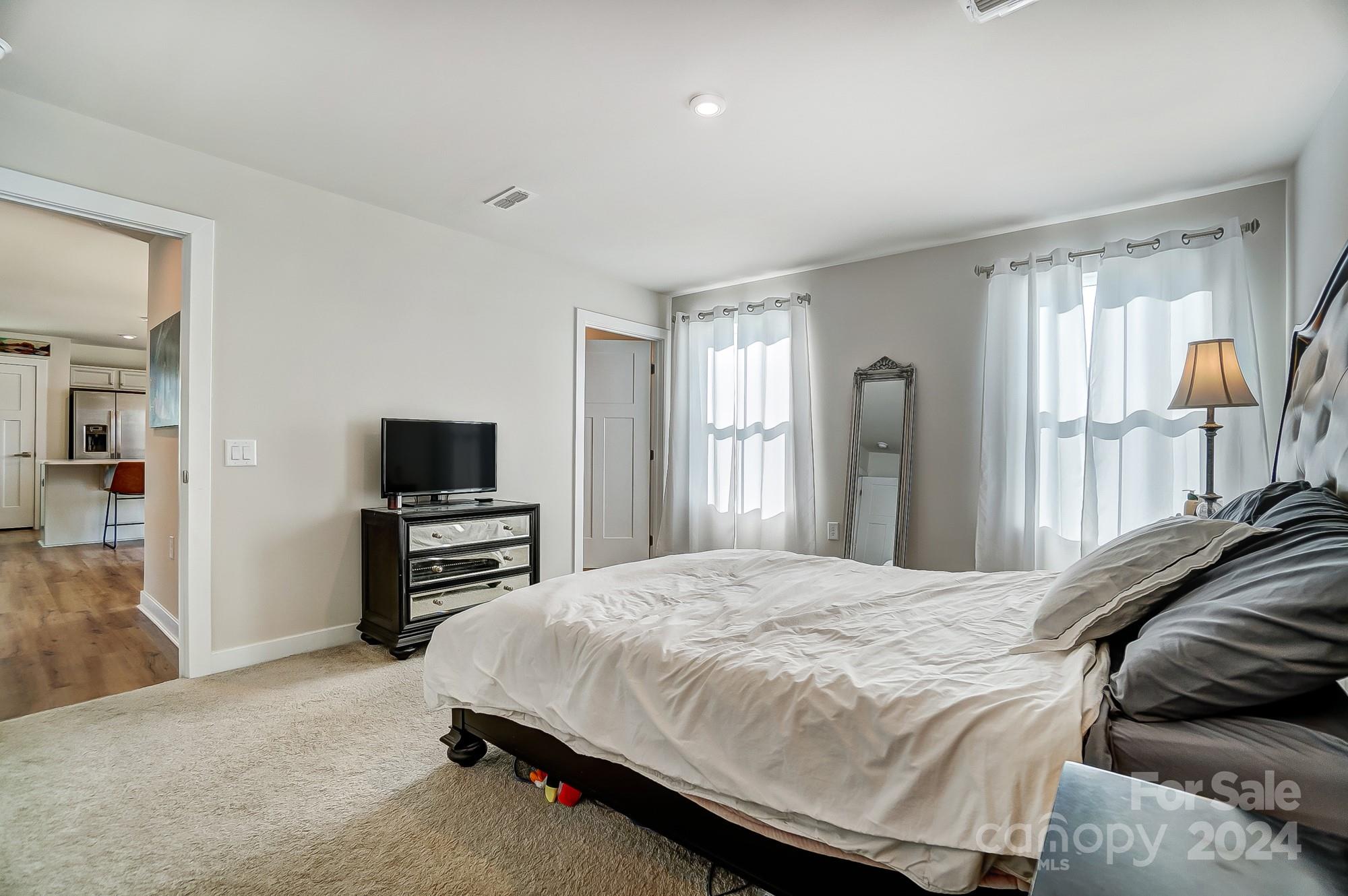 4136 Mackinnon Drive Charlotte, NC 28214 - Photo 20 of 48 a bedroom with a bed and a television