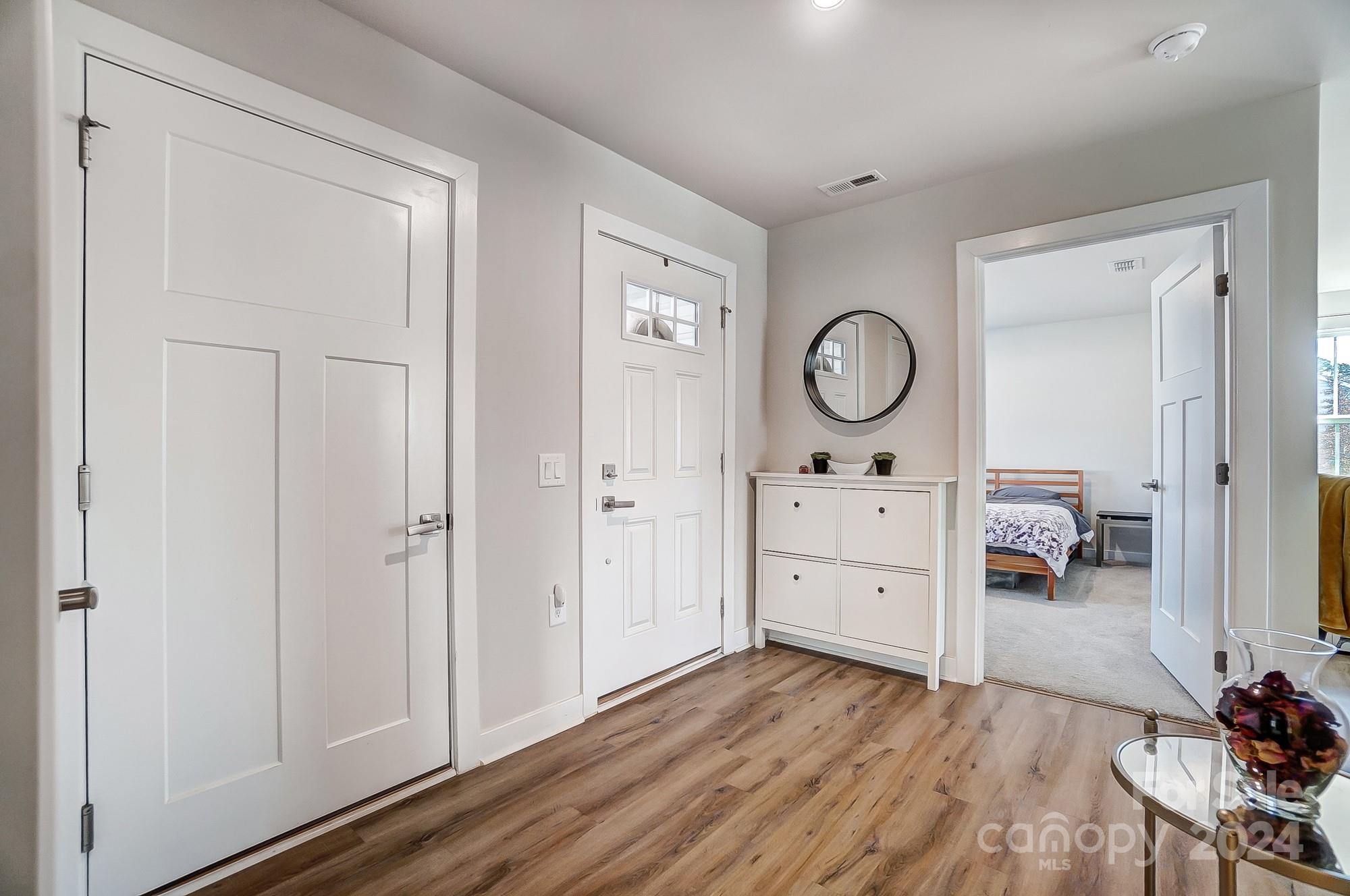 4136 Mackinnon Drive Charlotte, NC 28214 - Photo 2 of 48 a living room with furniture and wooden floor