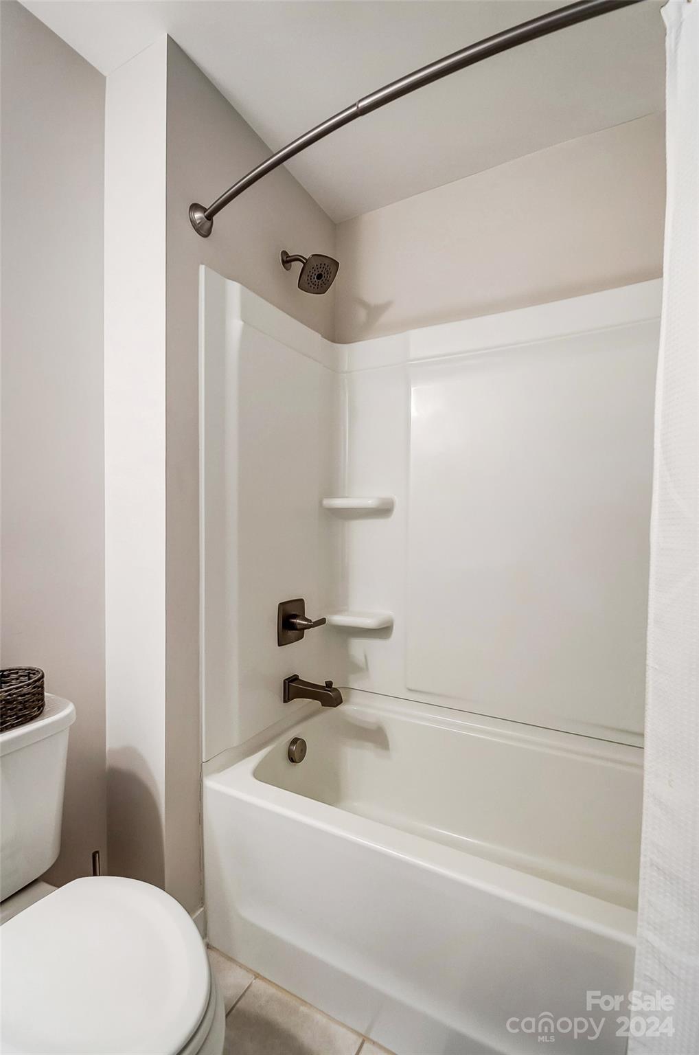 4136 Mackinnon Drive Charlotte, NC 28214 - Photo 34 of 48 a bathroom with a toilet and a shower