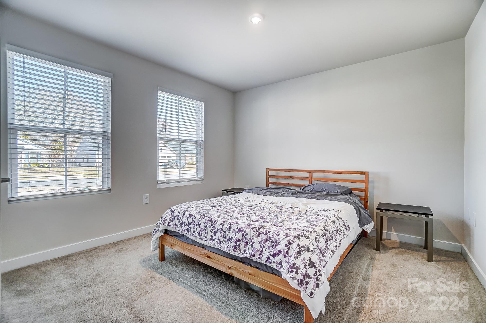 4136 Mackinnon Drive Charlotte, NC 28214 - Photo 35 of 48 a bedroom with a bed and next to a window