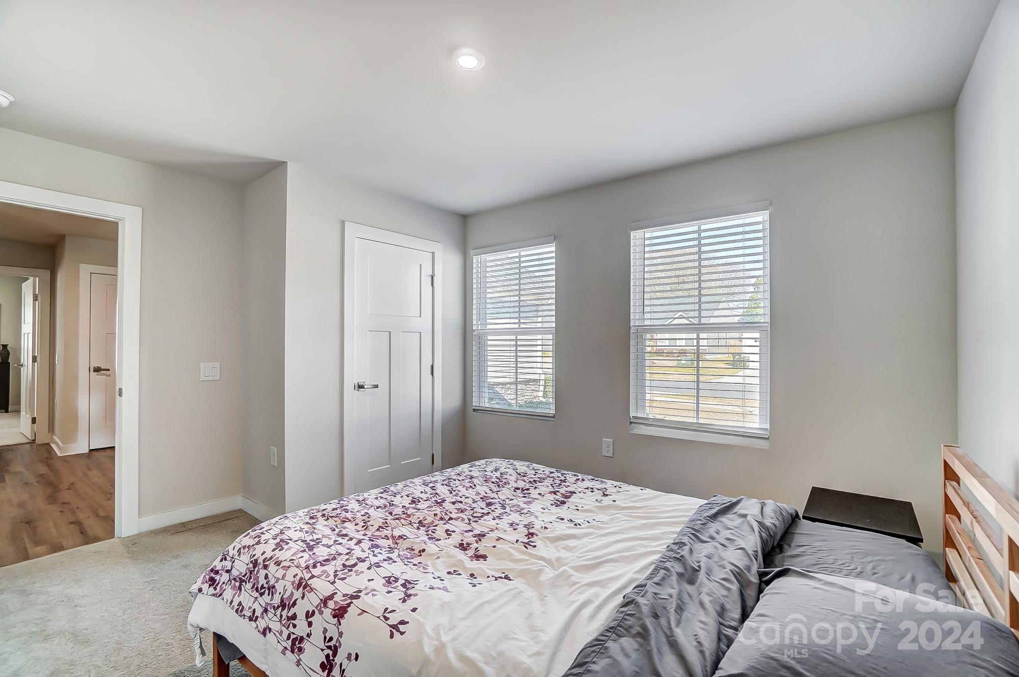 4136 Mackinnon Drive Charlotte, NC 28214 - Photo 36 of 48 a bedroom with a bed and a window