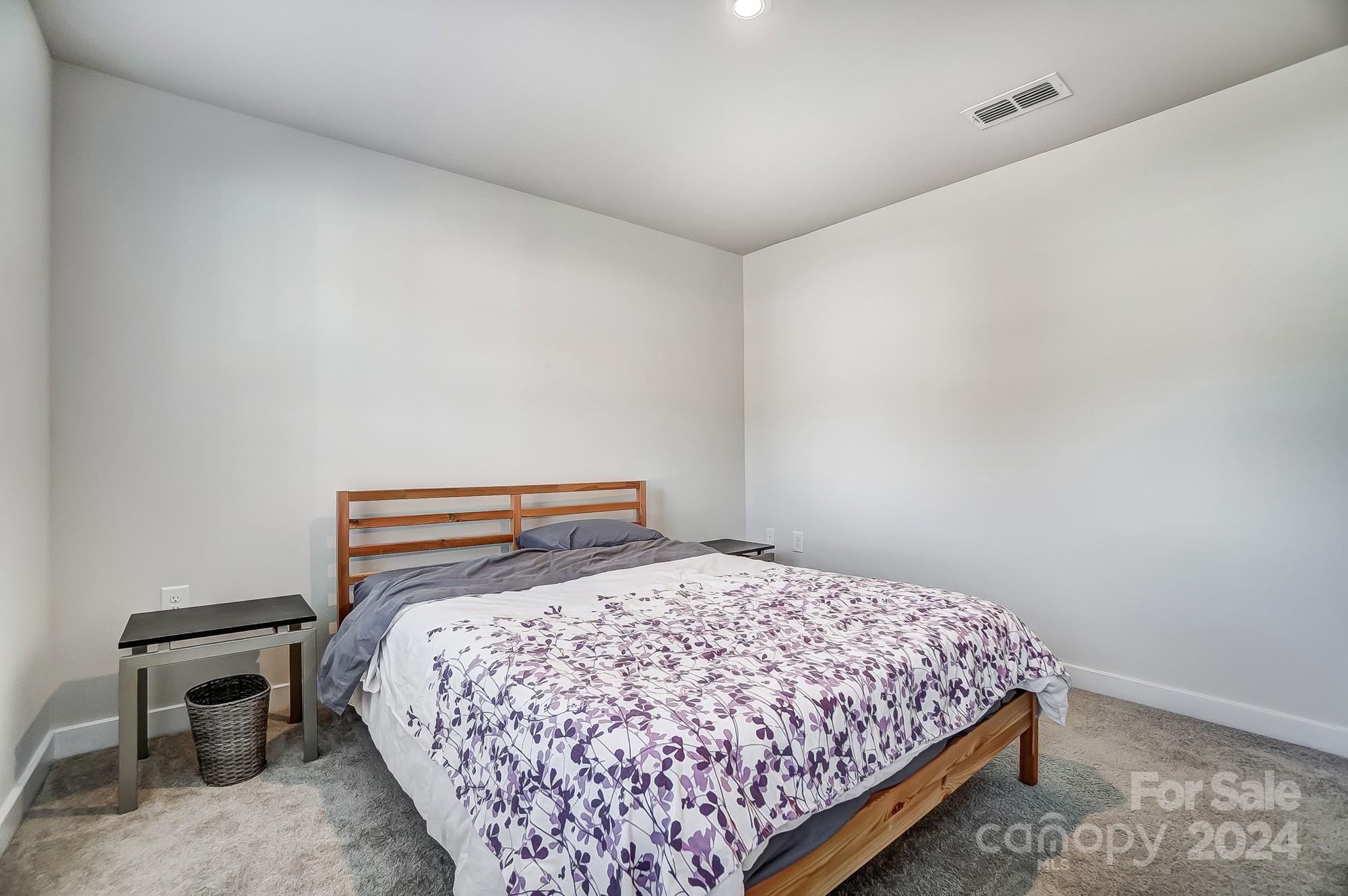 4136 Mackinnon Drive Charlotte, NC 28214 - Photo 37 of 48 a bedroom with a bed a table and chair