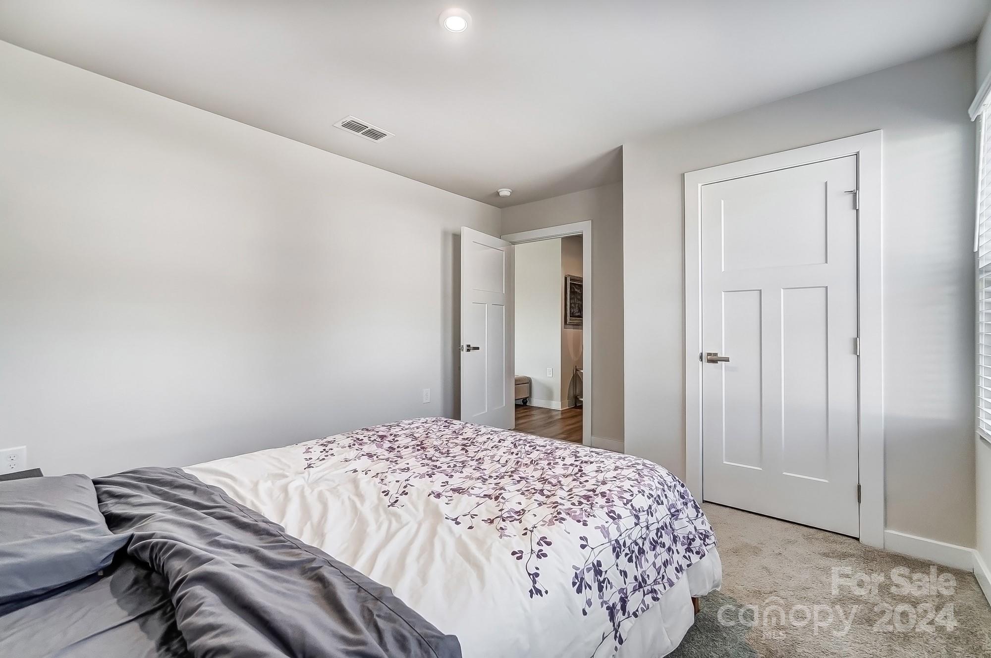 4136 Mackinnon Drive Charlotte, NC 28214 - Photo 38 of 48 a bedroom with a bed and a window