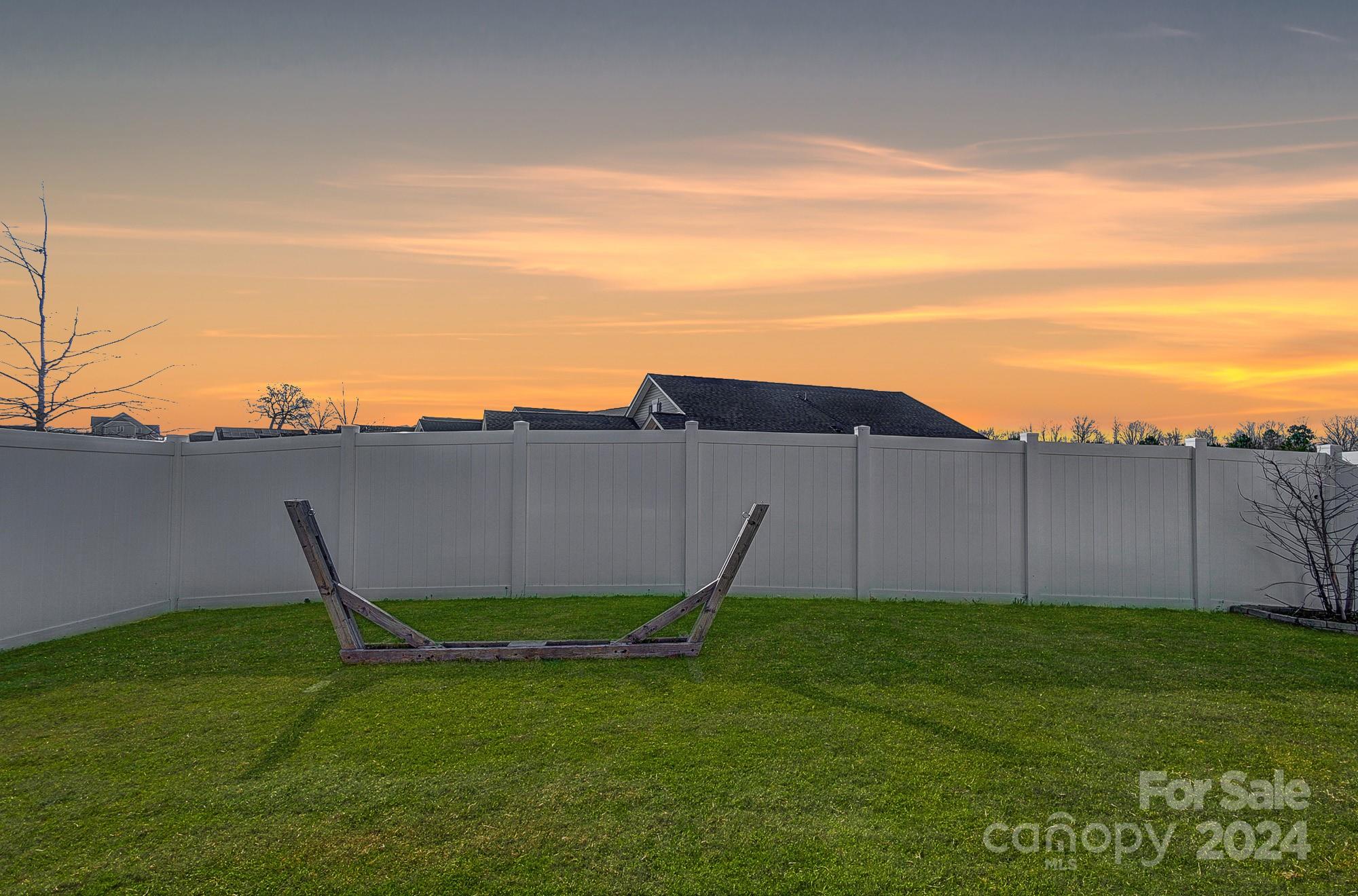 4136 Mackinnon Drive Charlotte, NC 28214 - Photo 44 of 48 a view of a table and chairs in the garden